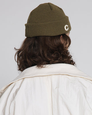 model-wearing-undercontrol-brand-c-logo-beanie-photo