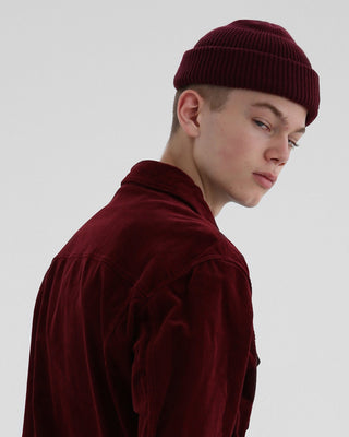 model-wearing-undercontrol-brand-wine-color-short-beanie-photo