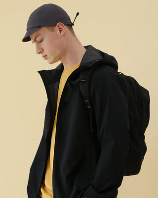 model-wearing-urh-brand-gray-color-flexible-visor-ball-cap-photo