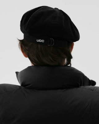 model-wearing-undercontrol-brand-black-color-solid-beret-photo