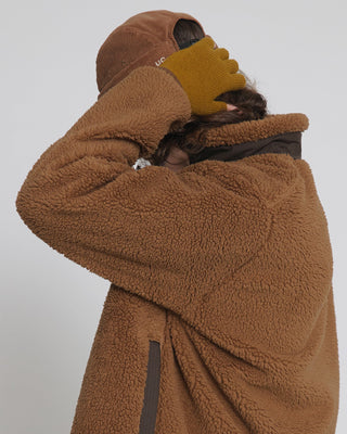 Fingerless gloves worn during a winter hike