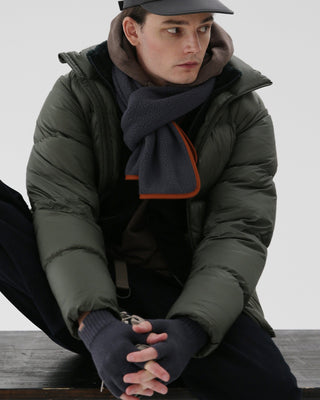 Fingerless gloves paired with a winter outfit
