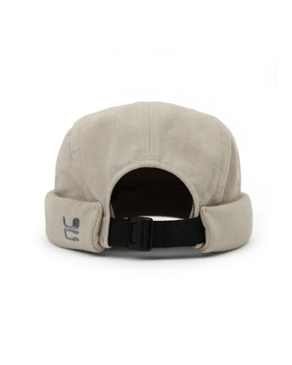 Watch cap paired with outdoor gear